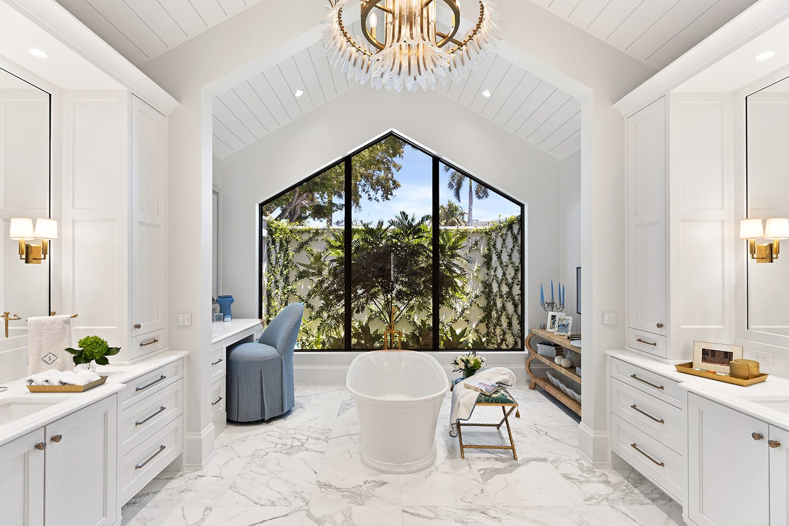 Primary bath with soaking tub beneath a cathedral window
